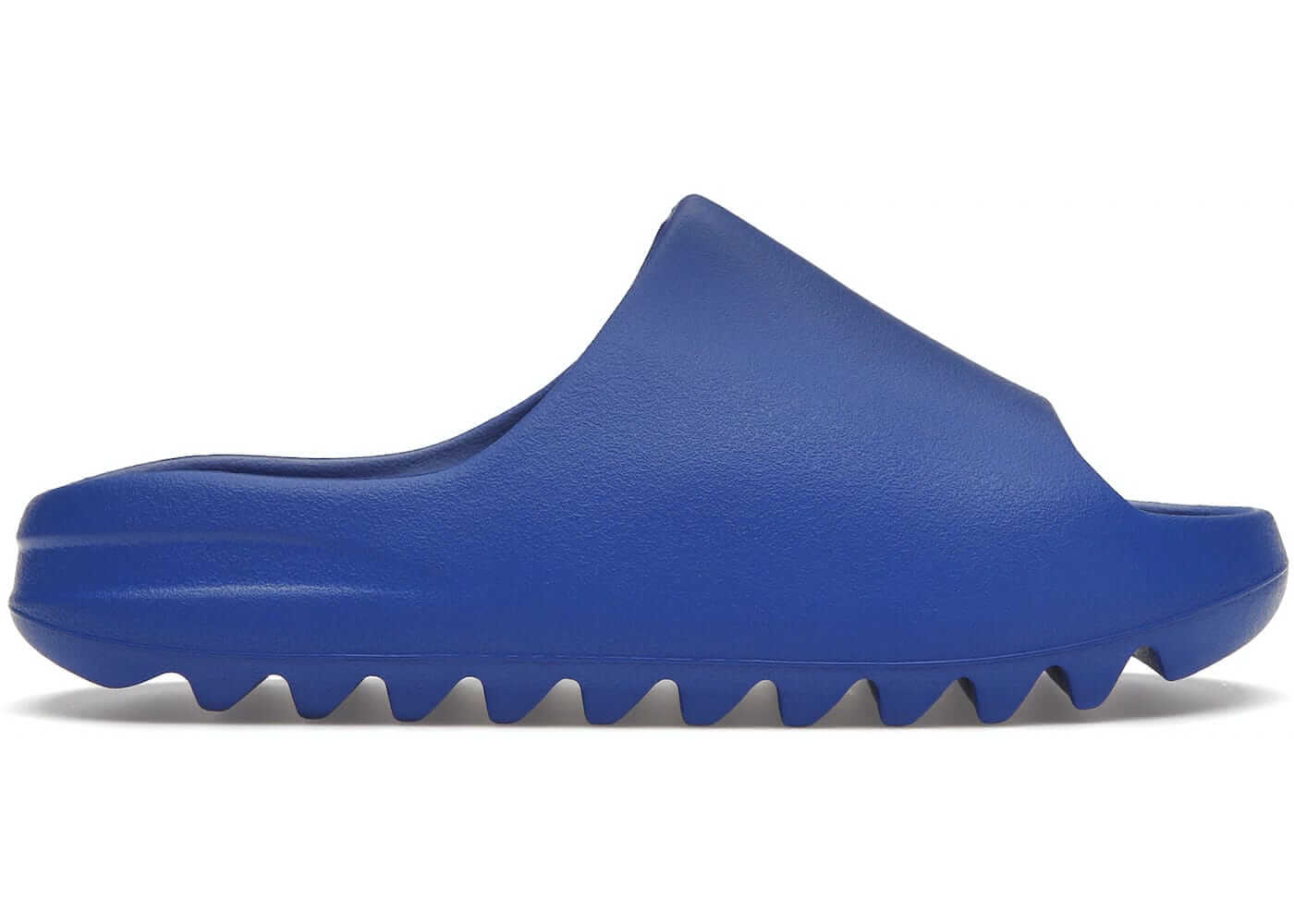 adidas Yeezy Slide Azure in blue view from the side, showcasing the unique design and textured sole.