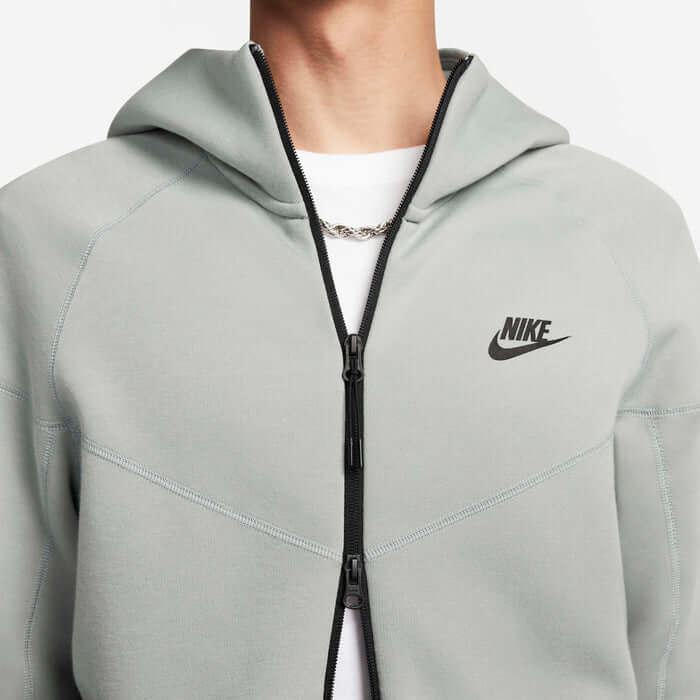 Nike Tech Fleece Windrunner Hoodie in Mica Green, featuring a full zip and iconic logo, perfect for athletic layering.
