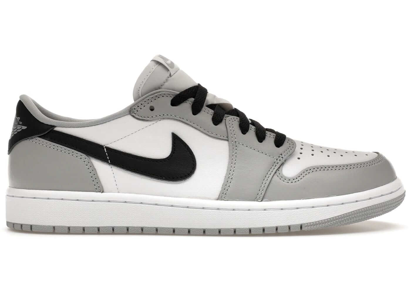 Jordan 1 Retro Low OG Barons sneakers in grey and black, featuring classic low-top design and authentic Nike branding.