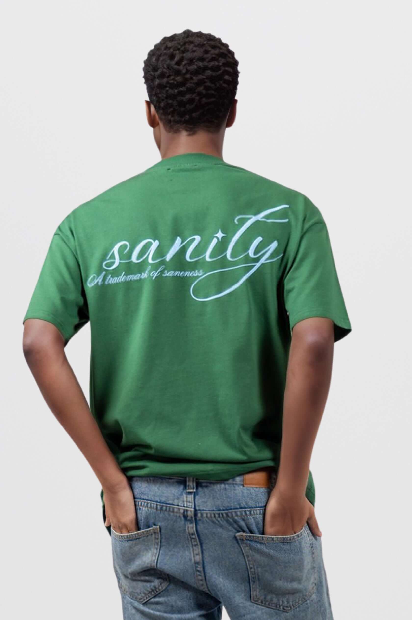 Back view of unisex forest green Sanity tee with light blue print and signature embroidery, styled for comfort.