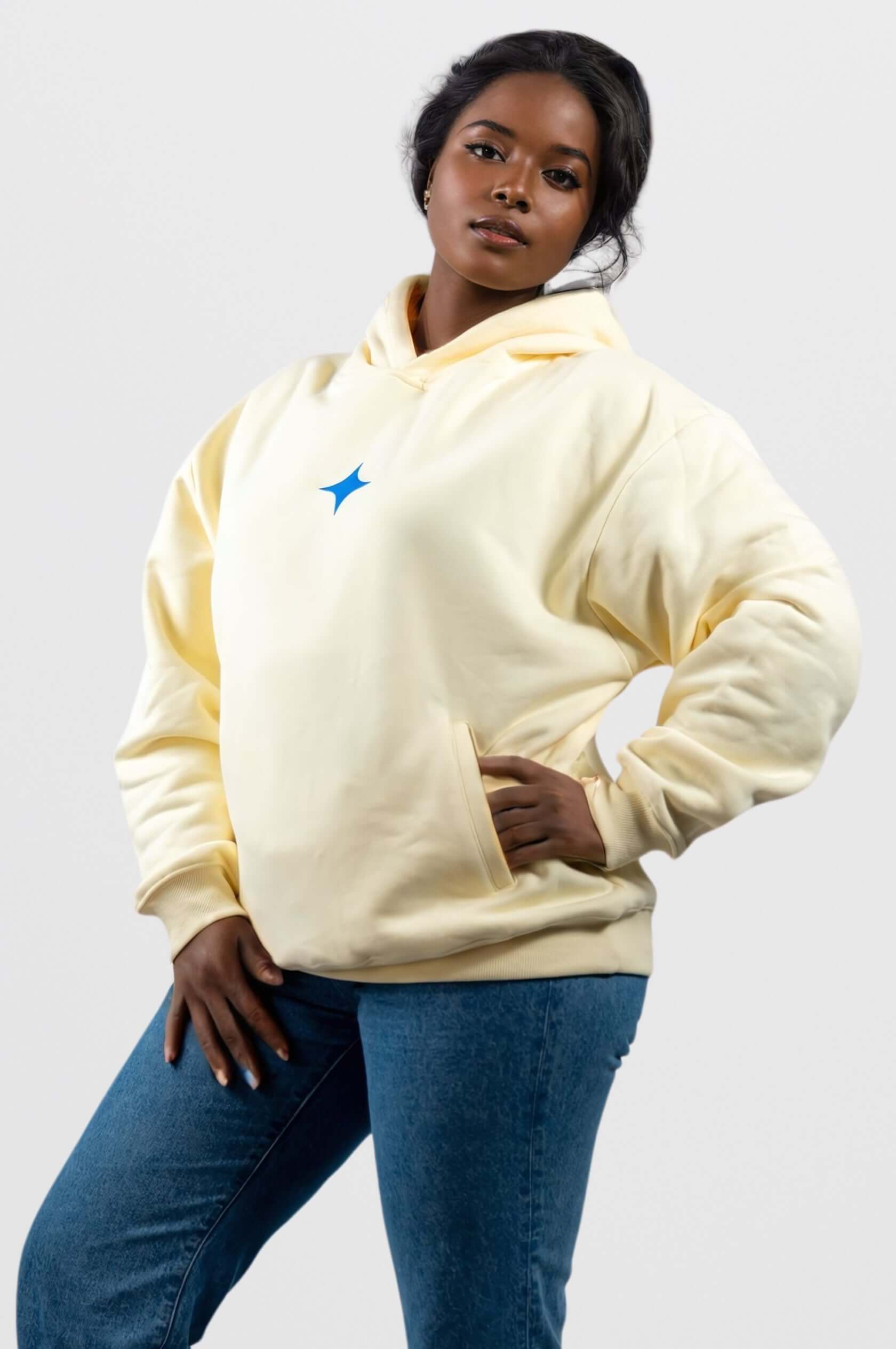 Cream oversized hoodie with blue star print, featuring a model for Sanity's Fragment Hoodie collection.