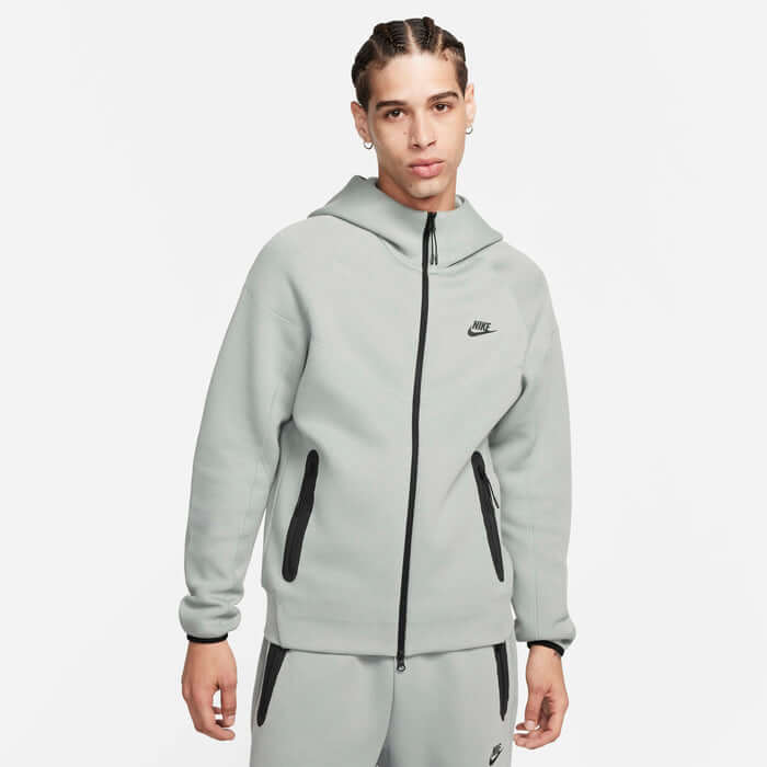 Nike Tech Fleece Windrunner Hoodie in Mica Green worn by model, featuring full zip and relaxed fit.