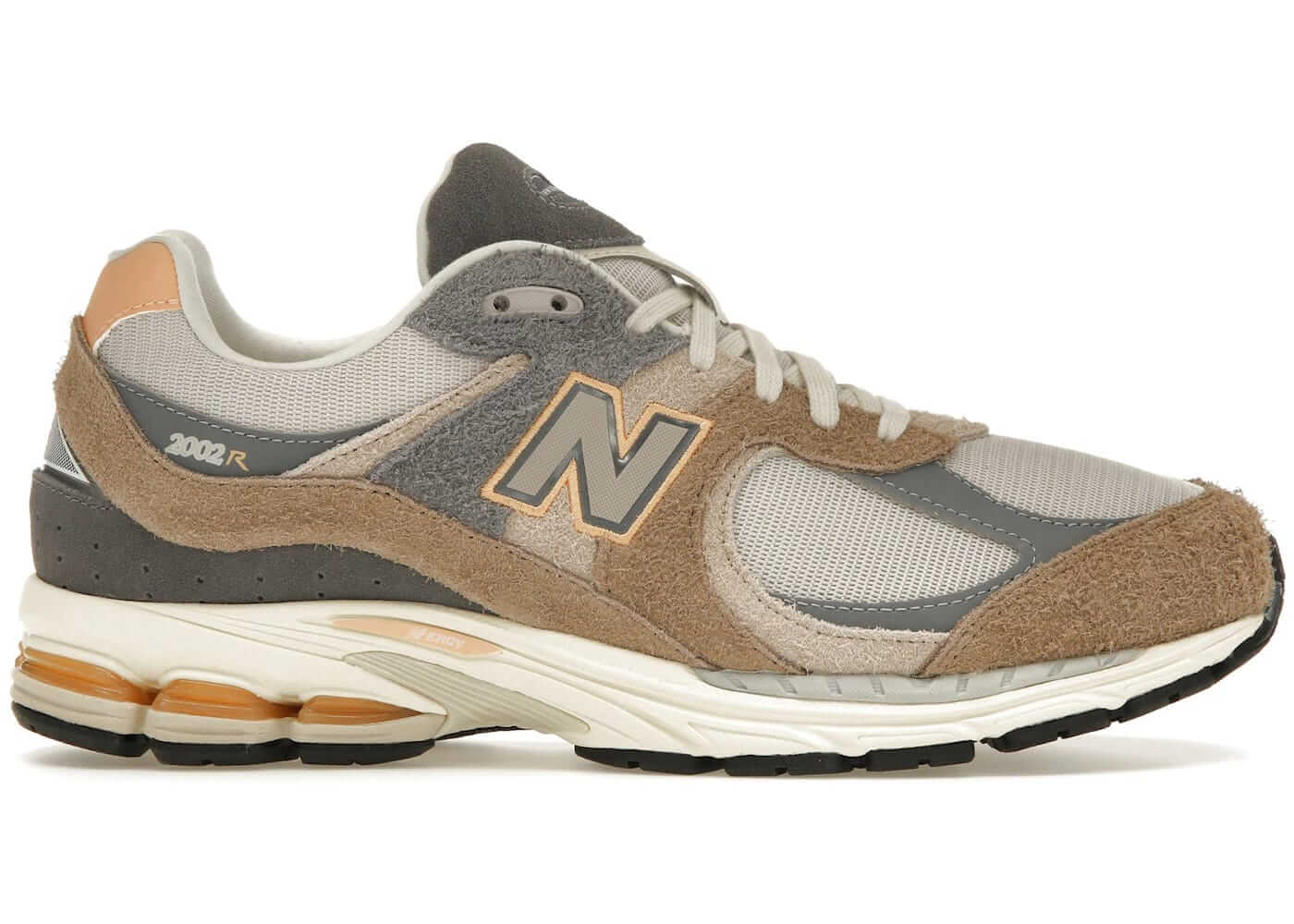 New Balance 2002R Mushroom Hazy Peach sneaker side view, premium materials, stylish design, size conversion available.
