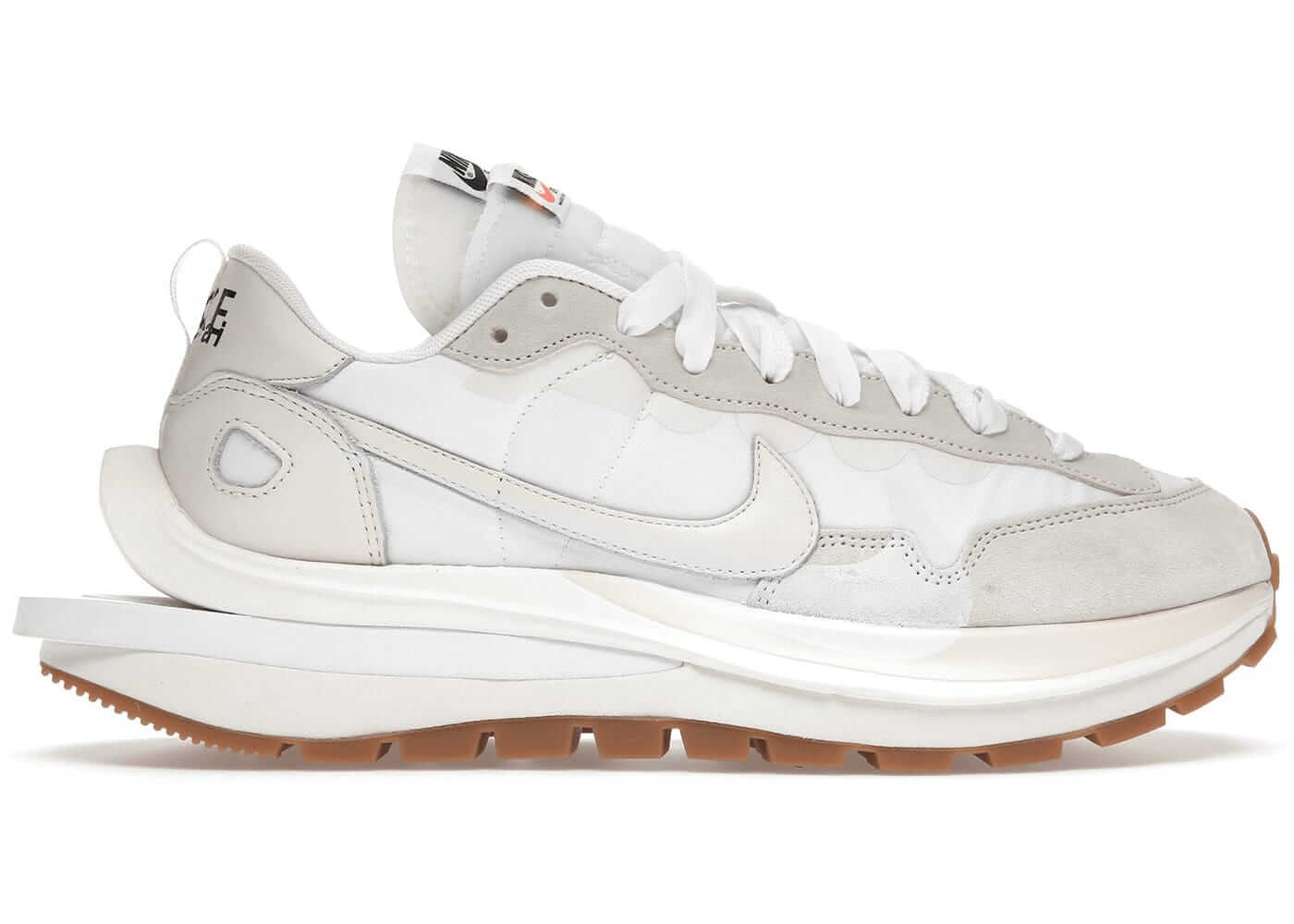 Nike Vaporwaffle sacai Sail Gum sneakers showcasing a sleek, modern design with a gum sole and light color palette.