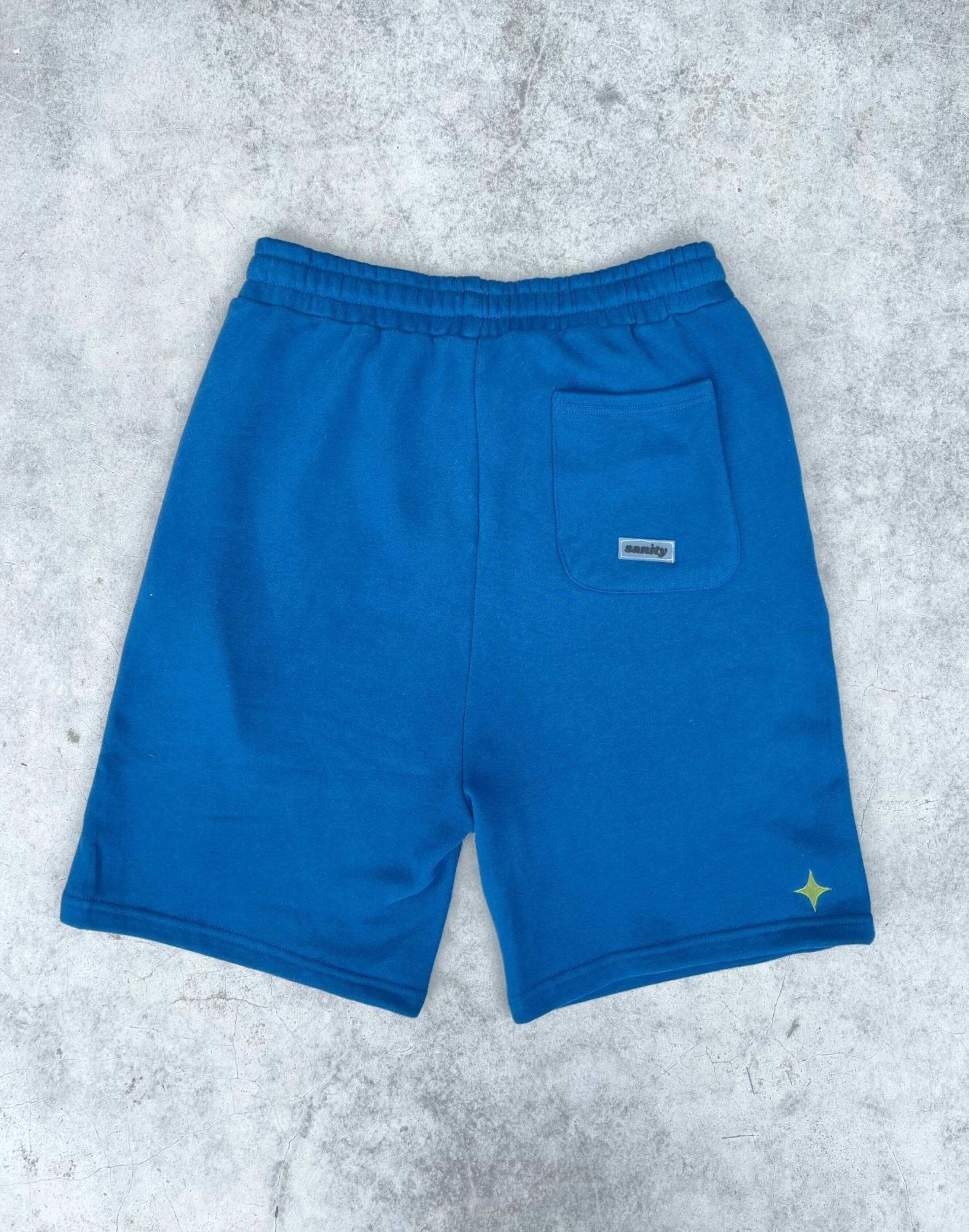 Men's Deep Sea Shorts in bold navy, featuring a relaxed fit, secure drawcord, and spacious back pocket.