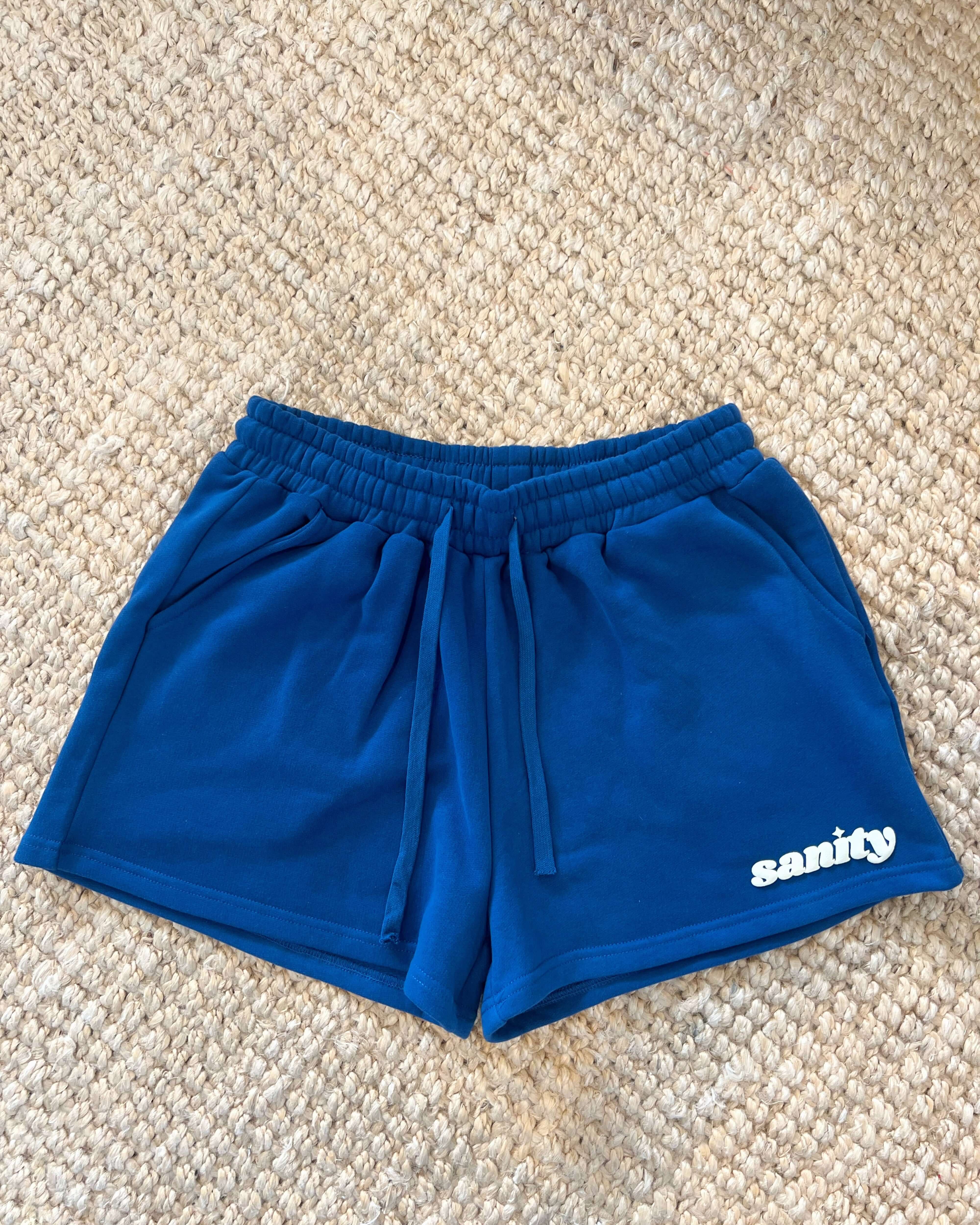 Sanity Deep Sea Women's Shorts in deep navy, featuring a draw cord and spacious pockets for comfort and style.