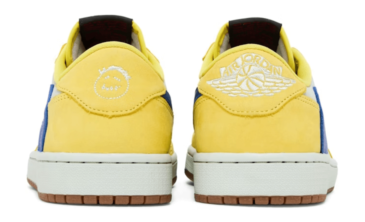 Back view of women's Jordan 1 Retro Low OG SP Travis Scott Canary sneakers with yellow and blue accents.