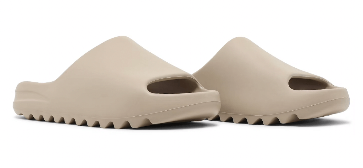 adidas Yeezy Slide Pure restock pair in beige, featuring a modern slide design and authentic fit for comfort.