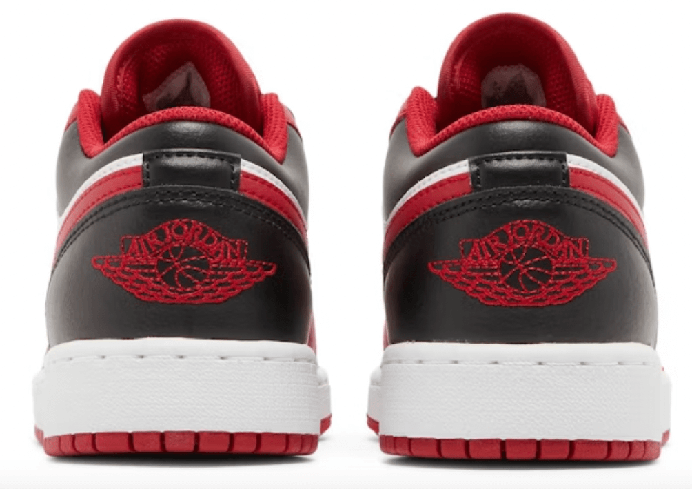 Back view of Jordan 1 Low Bulls (GS) sneakers featuring red and black colorway with logo details.