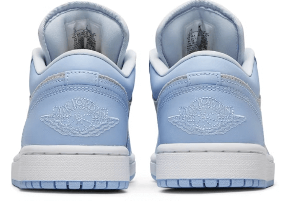 Jordan 1 Low Football Grey Aluminum women's sneaker back view featuring signature logo and light blue color.