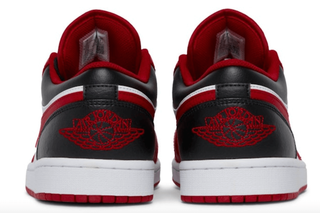 Back view of Jordan 1 Low Reverse Black Toe shoes for women showcasing red and black design, 100% authentic with express shipping.