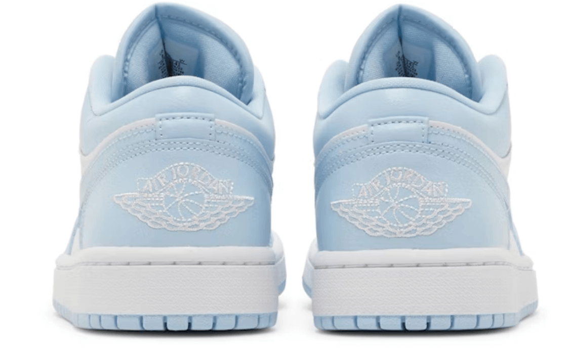 Rear view of Nike Jordan 1 Low White Ice Blue women's sneakers showcasing light blue color and classic logo.