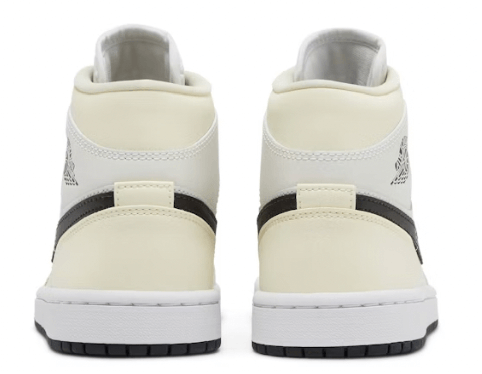 Back view of Jordan 1 Mid Coconut Milk sneakers for women, showcasing cream and black colorway with iconic branding.