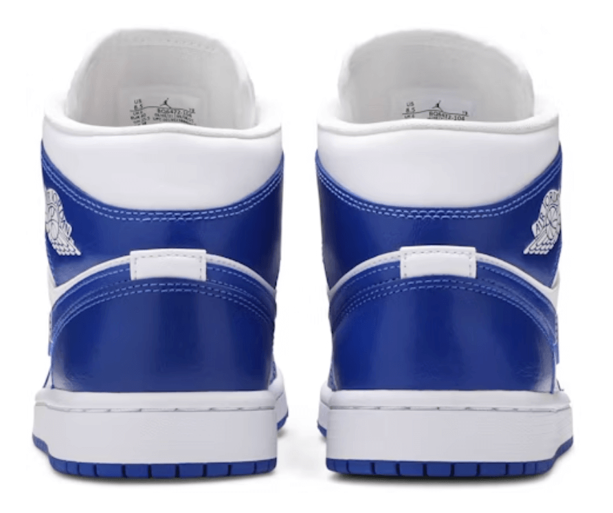 Back view of women's Jordan 1 Mid Kentucky Blue sneakers with white detailing and iconic logo.