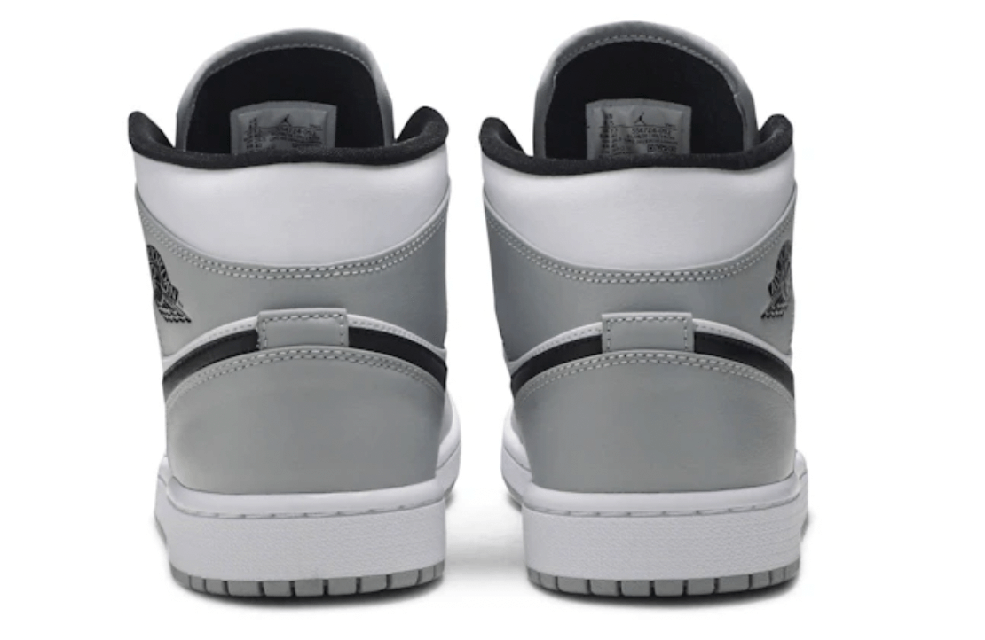 Jordan 1 Mid Light Smoke Grey sneakers rear view with authentic design and premium materials.