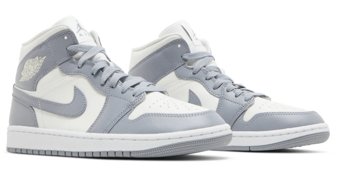 Jordan 1 Mid Stealth women's shoes in grey and white with classic design, brand new and 100% authentic.