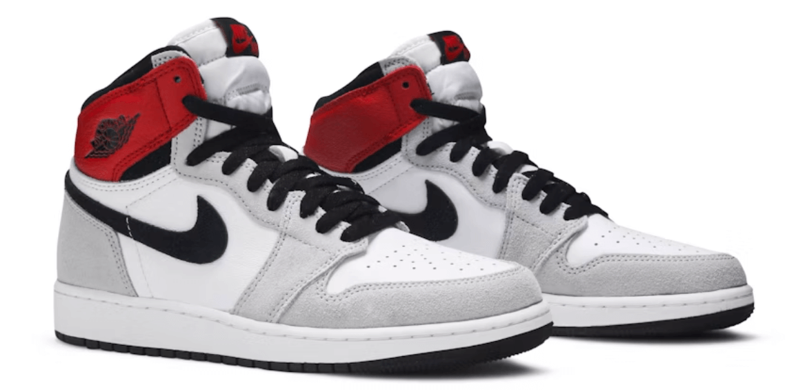 Jordan 1 Retro High Light Smoke Grey (GS) sneaker featuring white, grey, and red accents with authentic design.