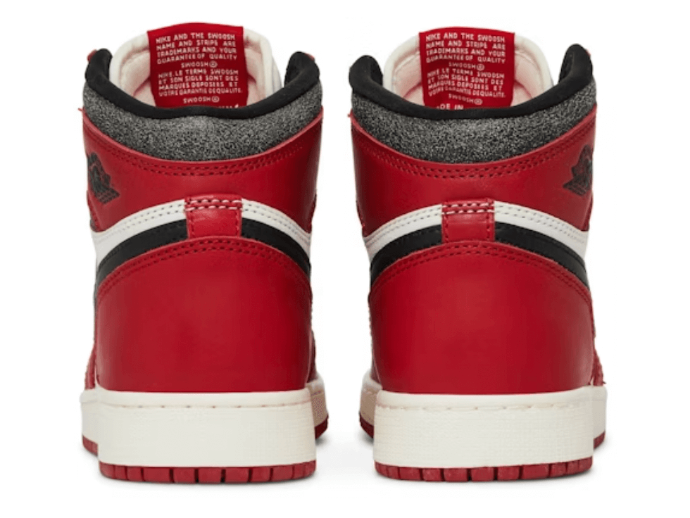 Back view of Jordan 1 Retro High OG Chicago Lost and Found sneakers in red and white, showcasing authentic design features.