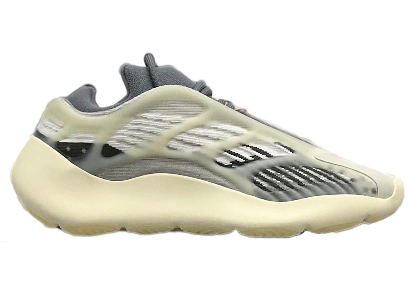 adidas Yeezy 700 V3 Fade Salt sneaker side view featuring a glow-in-the-dark cage and Primeknit upper.