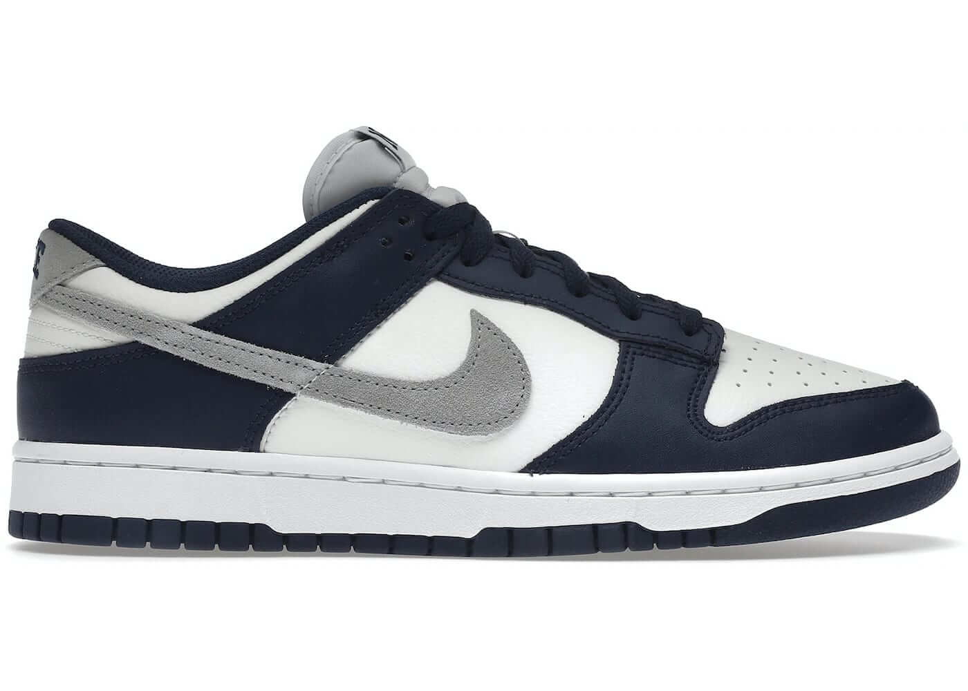 Nike Dunk Low Summit White Midnight Navy sneaker featuring a sleek design with navy blue and white accents.