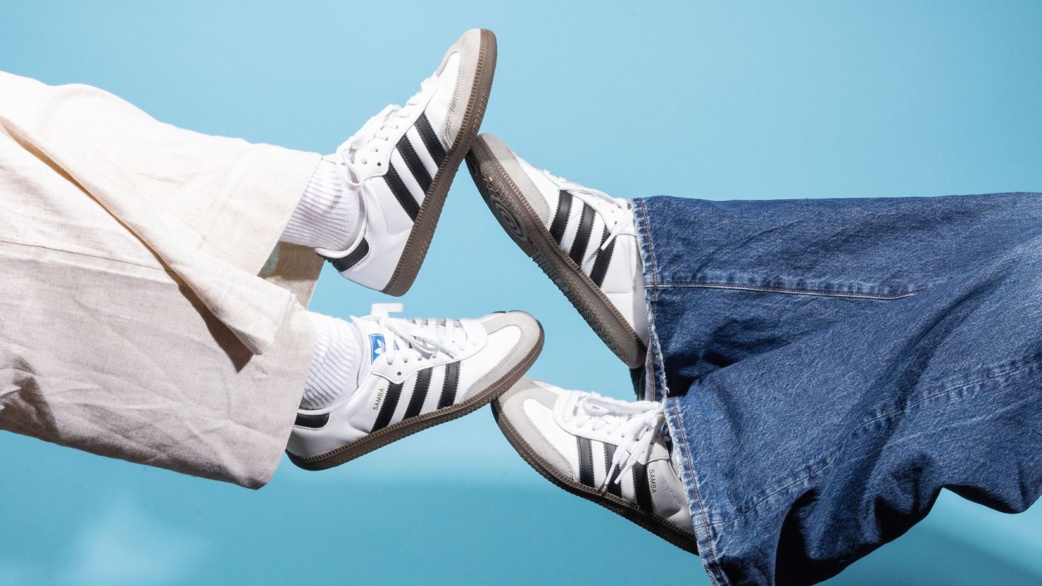 Two individuals wearing Adidas Samba sneakers, highlighting the shoe's iconic design and casual style.