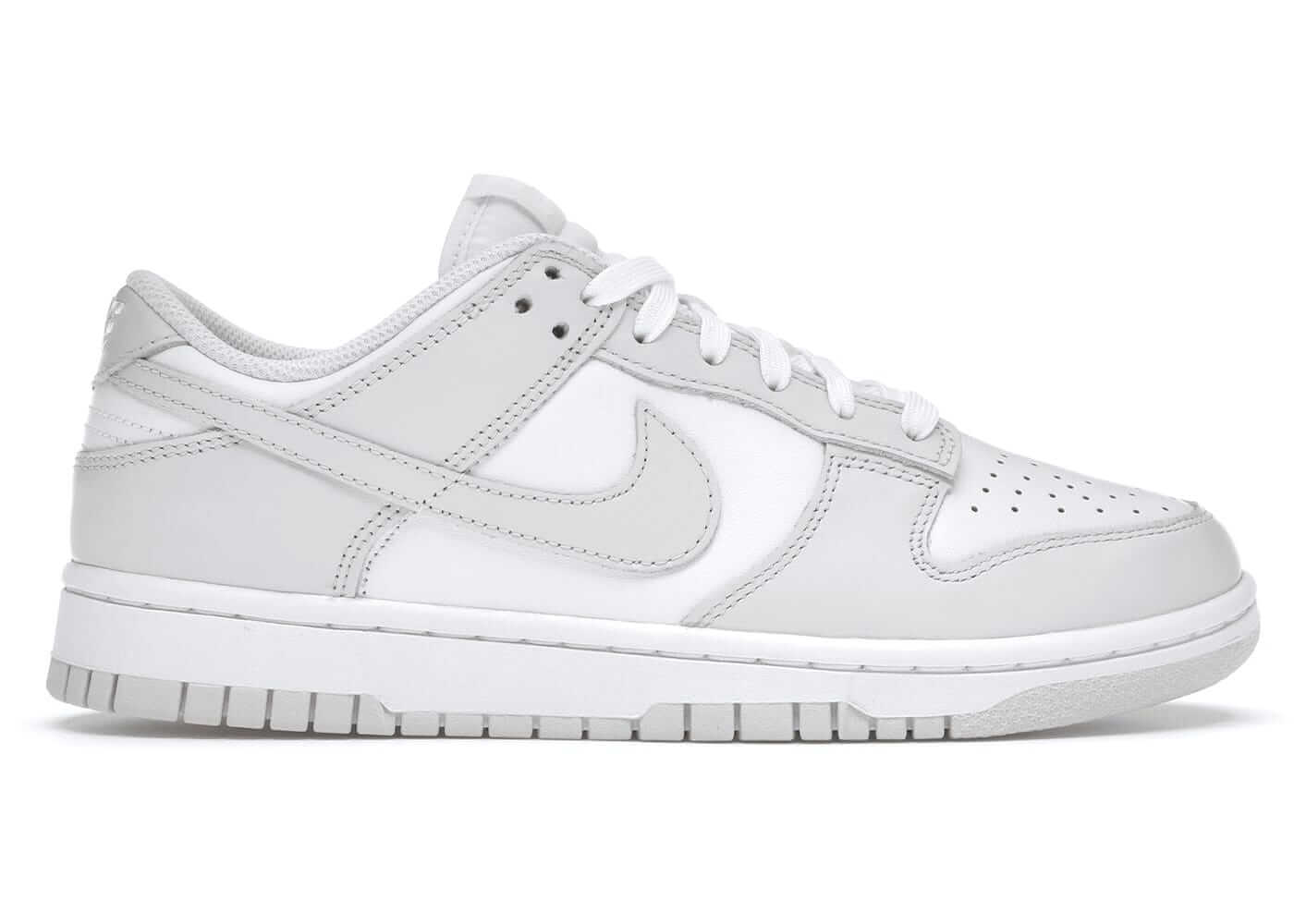 Nike Dunk Low Photon Dust women's sneakers in light gray with white accents, featuring classic low-top styling and premium materials.