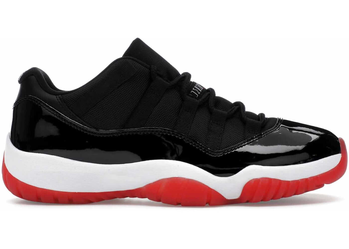 Air Jordan 11 Retro Low Bred 2025 featuring black mesh, patent leather, red accents, and a white midsole.